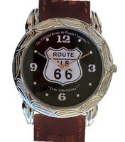 Western Style Route 66 Collectible By the Official Route 66 Company Has a Round Shape Polished Chrome Case with Artistic Decorative Embossing and Brown Western Style Leather Strap