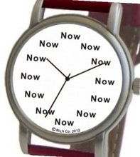 "Now" Is the Time That Is Shown Each Hour on the White Dial of the Brushed Chrome Round Shape with a Red Leather Strap