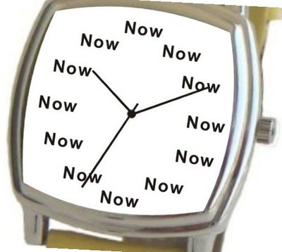 "Now" Is the Time That Is Shown Each Hour on the White Dial of the Polished Chrome Cushion Shape with a Yellow Leather Strap